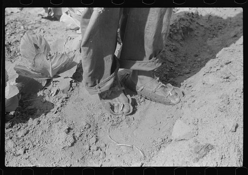 Untitled photo, possibly related to: Rehabilitation borrower's shoes, made out of tire casings. Greene County, Georgia