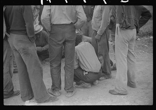 Untitled photo, possibly related to: Vegetable pickers, migrants, waiting after work to be paid. Near Homestead, Florida