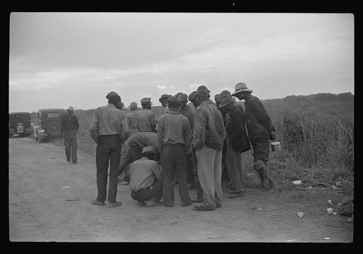 Untitled photo, possibly related to: Vegetable pickers, migrants, waiting after work to be paid. Near Homestead, Florida