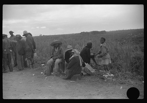 Untitled photo, possibly related to: Vegetable pickers, migrants, waiting after work to be paid. Near Homestead, Florida