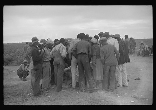 Untitled photo, possibly related to: Vegetable pickers, migrants, waiting after work to be paid. Near Homestead, Florida