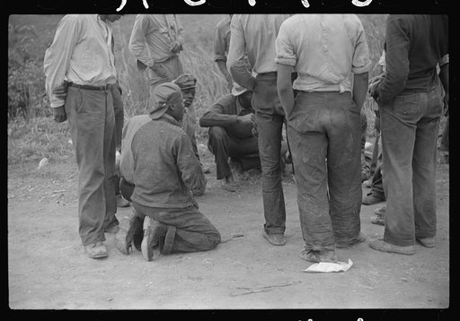 Untitled photo, possibly related to: Vegetable pickers, migrants, waiting after work to be paid. Near Homestead, Florida