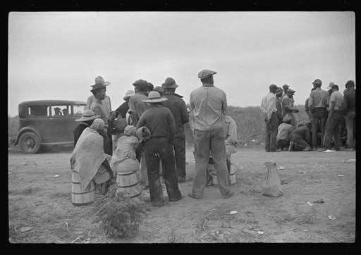Vegetable pickers, migrants, waiting after work to be paid. Near Homestead, Florida