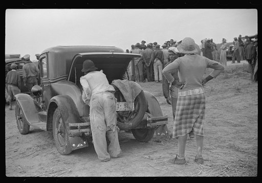 Vegetable pickers, migrants, waiting after work to be paid. Near Homestead, Florida