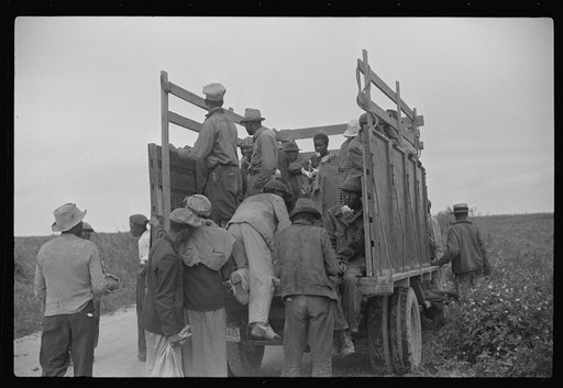 Vegetable pickers, migrants, waiting after work to be paid. Near Homestead, Florida