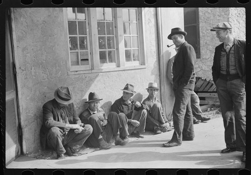 Untitled photo, possibly related to: Migratory packinghouse workers waiting around post office during slack season. Belle Grande, Florida