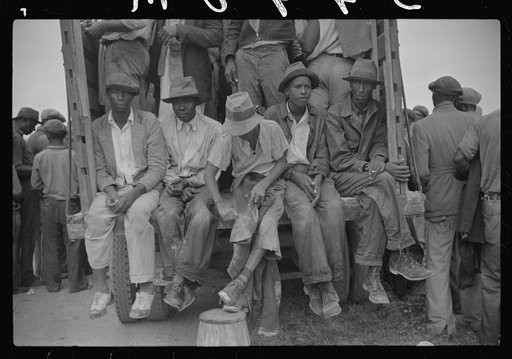 Vegetable workers, migrants, waiting after work to be paid. Near Homestead, Florida