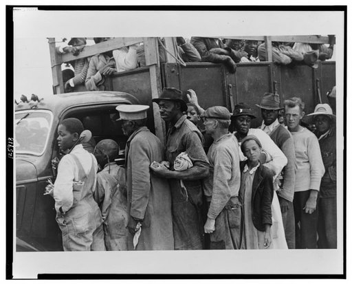 Vegetable workers, migrants, waiting after work to be paid. Near Homestead, Florida