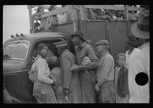 Untitled photo, possibly related to: Vegetable workers, migrants, waiting after work to be paid. Near Homestead, Florida