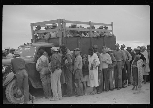 Vegetable workers, migrants, waiting after work to be paid. Near Homestead, Florida