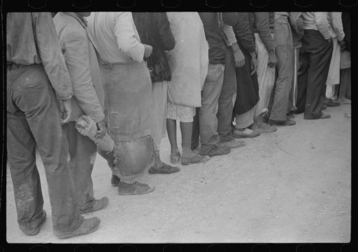 Vegetable workers, migrants, waiting after work to be paid. Near Homestead, Florida
