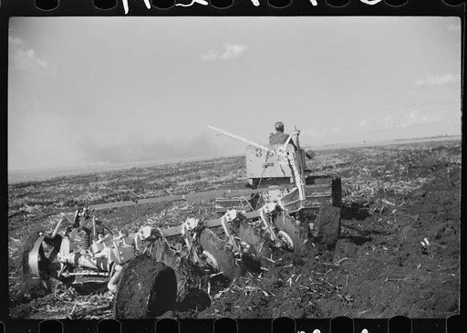 Discing the black mulch land before planting sugarcane for United States Sugar Corporation near Clewistown, Florida