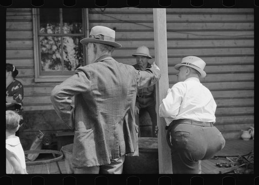 Spectators at auction sale of house and household goods, York County, Pennsylvania