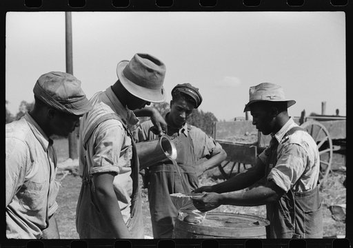 Untitled photo, possibly related to: A portable cane mill. The owner gets every sixth gallon for making the sorghum syrup. This is on the property of a Negro owner, Wess Cris, a tobacco farm of about 165 acres in a prosperous Negro settlement near Carr, Orange County, North Carolina. They are strain