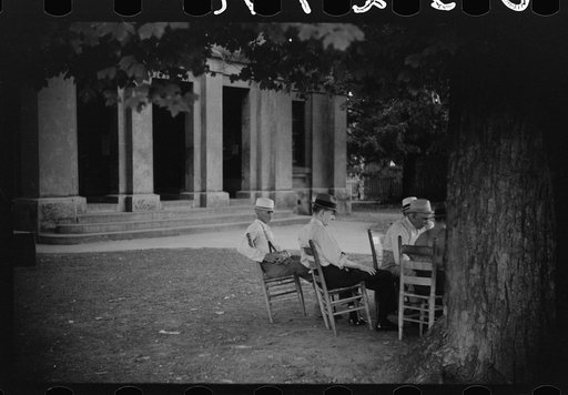 Townspeople and farmers playing cards in front of courthouse on Saturday afternoon in Yanceyville, Caswell County, North Carolina