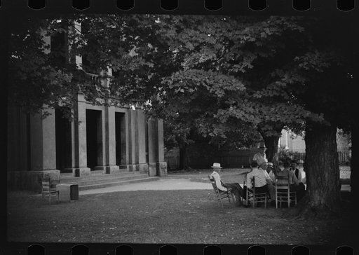 Townspeople and farmers playing cards in front of courthouse on Saturday afternoon in Yanceyville, Caswell County, North Carolina