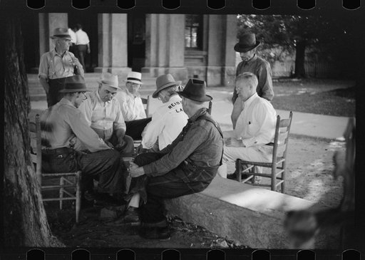 Townspeople and farmers playing cards in front of courthouse on Saturday afternoon in Yanceyville, Caswell County, North Carolina