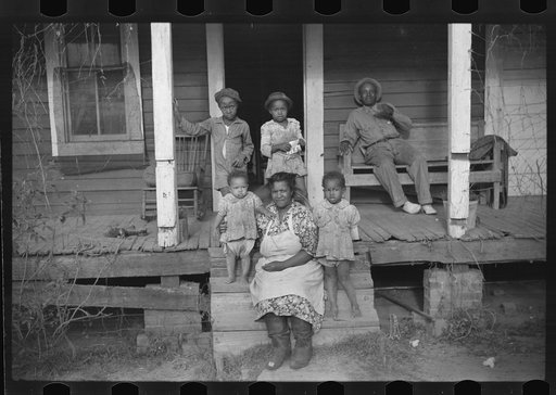 Untitled photo, possibly related to: One of tenant families on their porch, Marcella Plantation, Mileston, Mississippi Delta, Mississippi