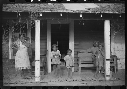 Untitled photo, possibly related to: One of tenant families on their porch, Marcella Plantation, Mileston, Mississippi Delta, Mississippi