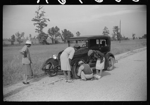 Repairing tire on road near Knowlton Plantation, Perthshire, Mississippi Delta, Mississippi
