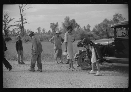 Repairing tire on road near Knowlton Plantation, Perthshire, Mississippi Delta, Mississippi