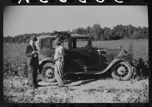 Mr. Jones, one of owners of Marcella Plantation, talking to one of day laborers who was picking his cotton, Marcella Plantation, Mileston, Mississippi Delta, Mississippi