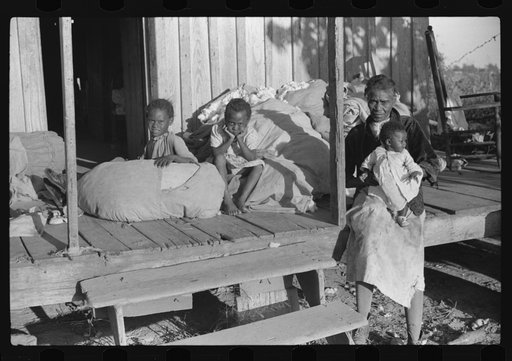 Home of Negro wagehand, Knowlton Plantation, Perthshire. On the porch are sacks of cotton. Mississippi Delta, Mississippi
