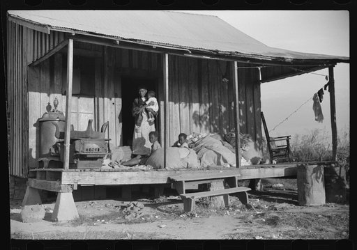 Home of Negro wagehand, Knowlton Plantation, Perthshire. On the porch are sacks of cotton. Mississippi, Delta Mississippi