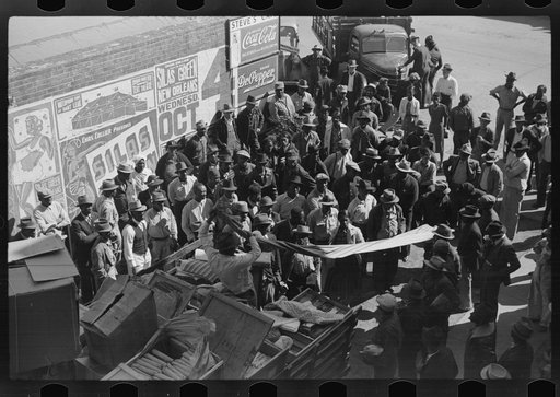 Itinerant salesman selling goods from his truck to Negroes in center of town on Saturday afternoon. Belzoni, Mississippi Delta, Mississippi