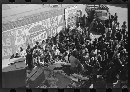 Untitled photo, possibly related to: Itinerant salesman selling goods from his truck to Negroes in center of town on Saturday afternoon. Belzoni, Mississippi Delta, Mississippi