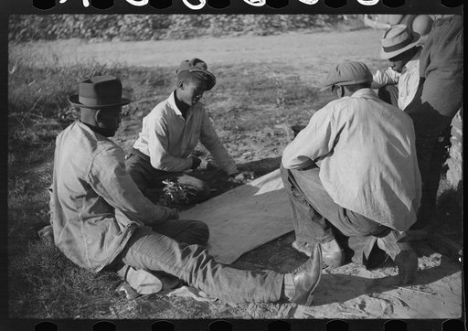 Untitled photo, possibly related to: Negroes shooting craps behind tenant house, disposing of their cotton money on Saturday afternoon, Marcella Plantation, Mileston, Mississippi Delta, Mississippi