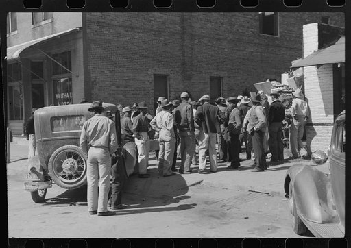 Untitled photo, possibly related to: Some of the Negroes watching itinerant salesman selling goods from his truck in center of town. On Saturday afternoon. Belzoni, Mississippi Delta, Mississippi
