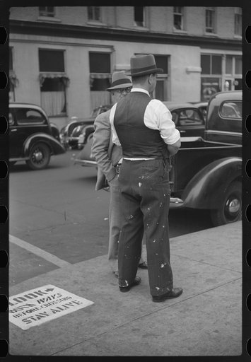 Cotton brokers talking outside cotton exchange building, Front Street, Memphis, Tennessee