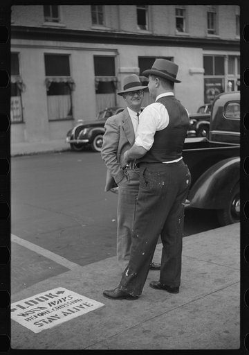 Untitled photo, possibly related to: Cotton brokers talking outside cotton exchange building, Front Street, Memphis, Tennessee
