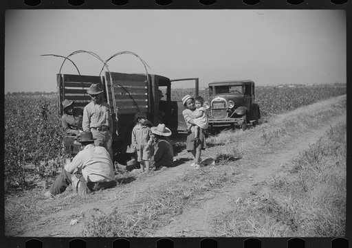 Mexican seasonal laborers resting during noon hour after picking cotton on Hopson Plantation, Clarksdale, Mississippi