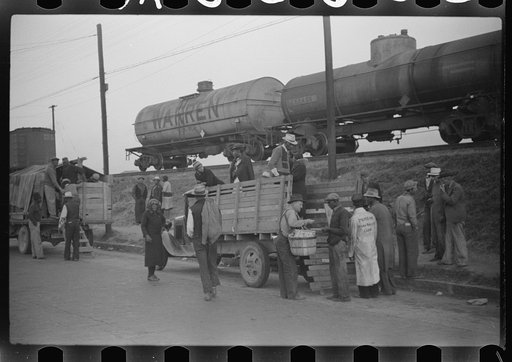 Untitled photo, possibly related to: Day laborers being hired for cotton picking on Mississippi and Arkansas plantations. Between four and six-thirty every morning during the season, near the Hallan Bridge in Memphis, Tennessee, crowds of Negroes in the streets gather and are loaded into trucks by d