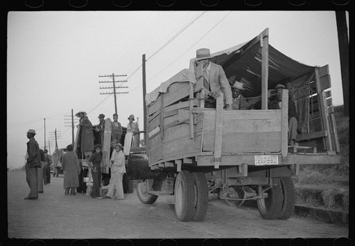 Day laborers being hired for cotton picking on Mississippi and Arkansas plantations. Between four and six-thirty every morning during the season, near the Hallan Bridge in Memphis, Tennessee, crowds of Negroes in the streets gather and are loaded into trucks by drivers who bid, and offer them anywhe