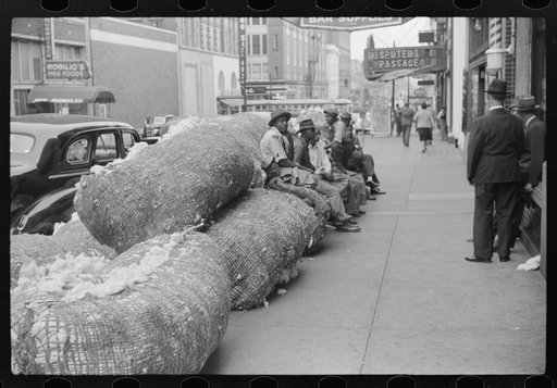 Untitled photo, possibly related to: Cotton snakes (waste cotton) on Cotton Row, Front Street, Memphis, Tennessee