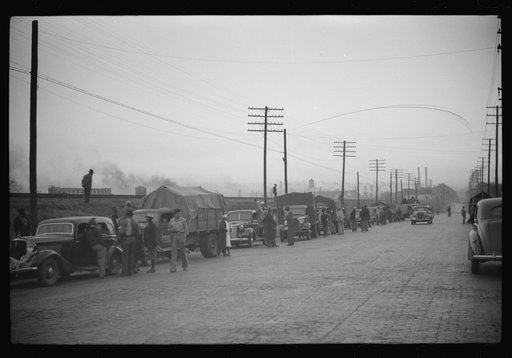 Untitled photo, possibly related to: Day laborers being hired for cotton picking on Mississippi and Arkansas plantations. Between four and six-thirty every morning during the season, near the Hallan Bridge in Memphis, Tennessee, crowds of Negroes in the streets gather and are loaded into trucks by d