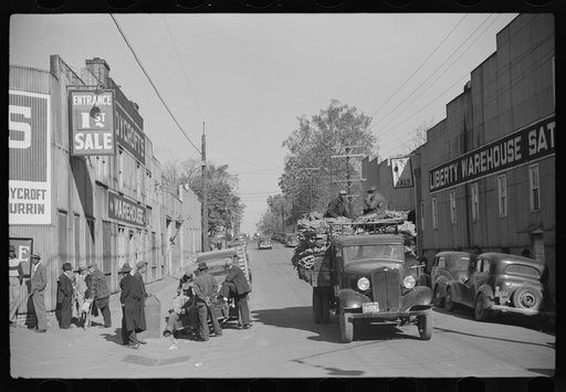Untitled photo, possibly related to: Truckload of tobacco after being sold at warehouse is hauled to the cigarette storage warehouse, Durham, North Carolina