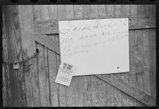 Sign on outside of tobacco warehouse during auction sales, Durham, North Carolina
