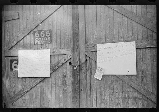 Untitled photo, possibly related to: Sign on outside of tobacco warehouse during auction sales, Durham, North Carolina