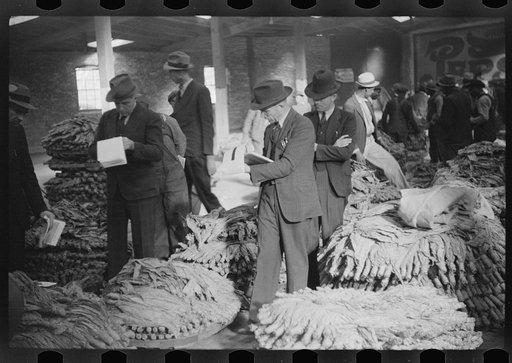 Untitled photo, possibly related to: Bookmen following the sale and checking the price of the tobacco for the warehouse, Durham, North Carolina