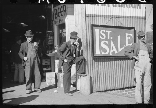 Untitled photo, possibly related to: Buyers looking at tobacco in warehouse during auction sales, Durham, North Carolina