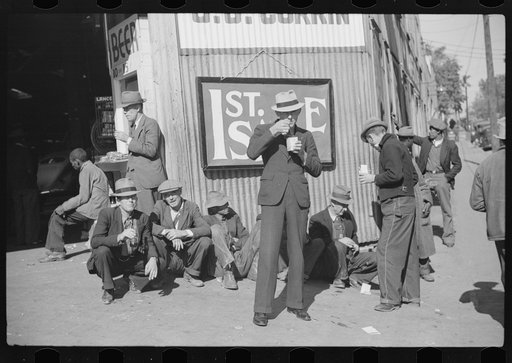 Untitled photo, possibly related to: Farmers eat a lot of ice cream and drink lots of beer while waiting for tobacco to be sold at auction sales outside warehouse, Durham, North Carolina