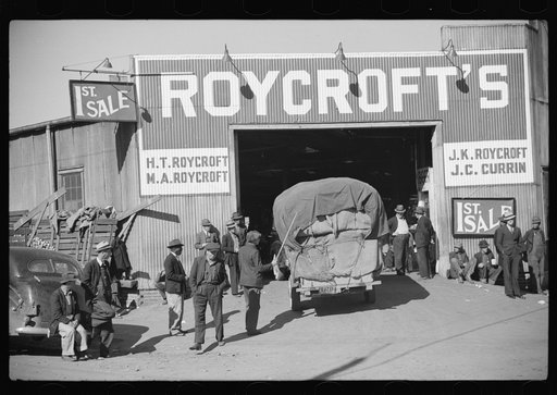 Tobacco being brought into warehouse on trailer for auction sale. Durham, North Carolina