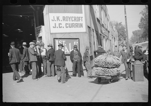 Untitled photo, possibly related to: Outside tobacco warehouse after auction sale. Durham, North Carolina