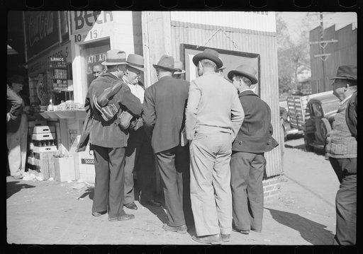 Untitled photo, possibly related to: Selling shoes to farmers outside warehouse during tobacco auction, Durham, North Carolina