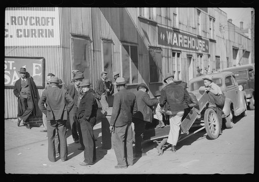 Untitled photo, possibly related to: Outside tobacco warehouse after auction sale. Durham, North Carolina