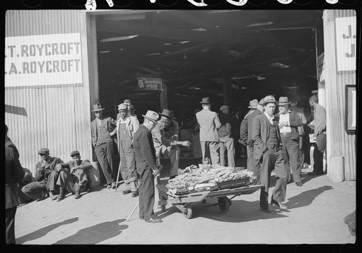 Untitled photo, possibly related to: Outside tobacco warehouse after auction sale. Durham, North Carolina